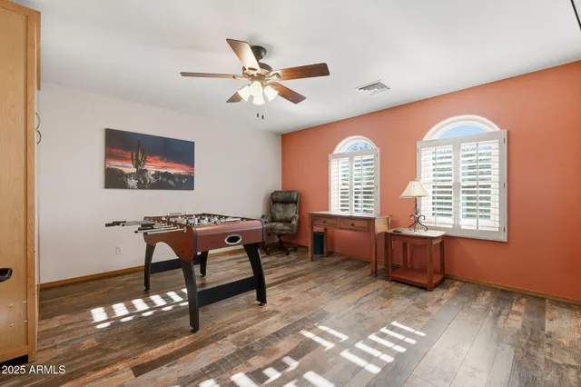 a view of a swimming pool with an outdoor seating and a yard