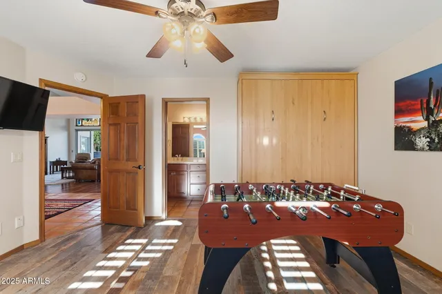a view of a patio with swimming pool table and chairs