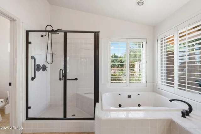 a view of a backyard with plants and a patio