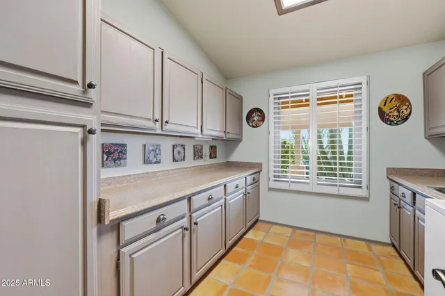 an aerial view of a house with a garden and plants