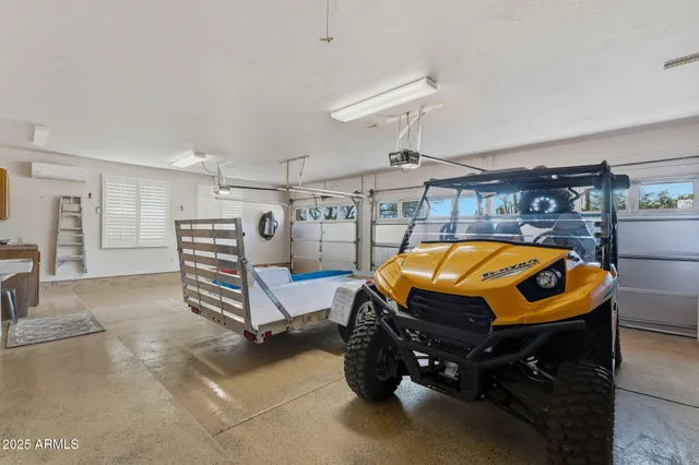 an aerial view of a house with garden space and outdoor seating