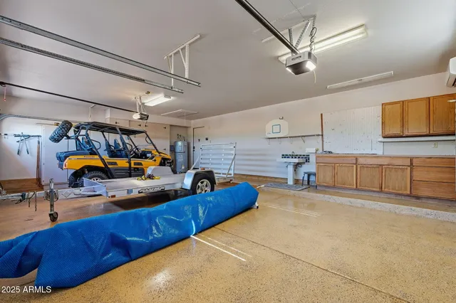 an aerial view of a house with a yard and potted plants