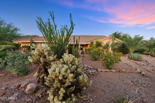a kitchen with granite countertop white cabinets and a stove top oven