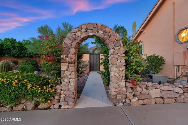 a kitchen with stainless steel appliances granite countertop a sink and stove