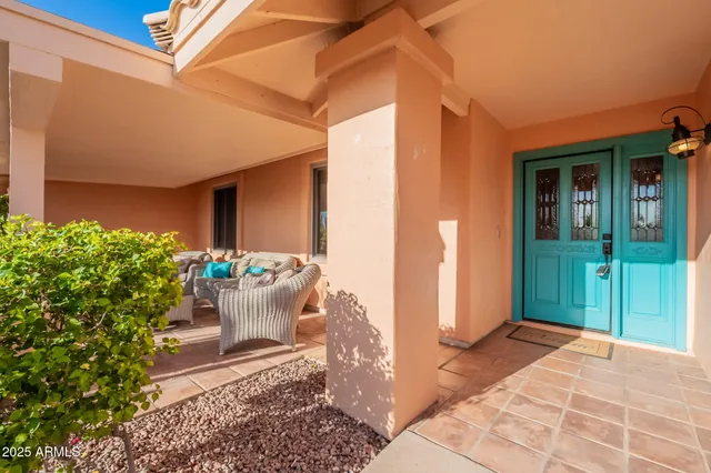 a view of a dining room and livingroom with furniture window and outside view