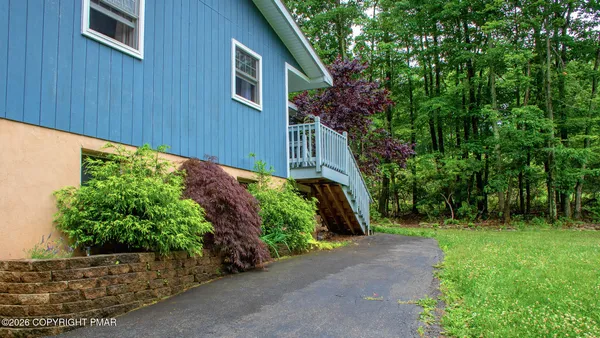 a backyard of a house with lots of green space