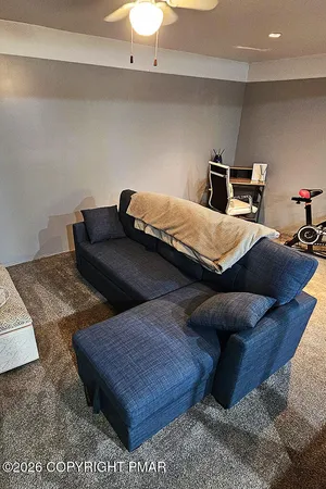 a bedroom with a bed and a couch
