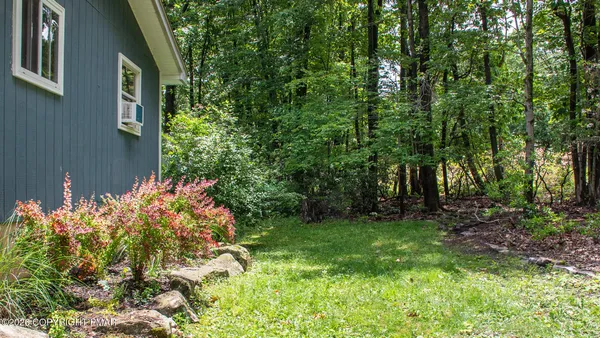a backyard of a house with lots of green space