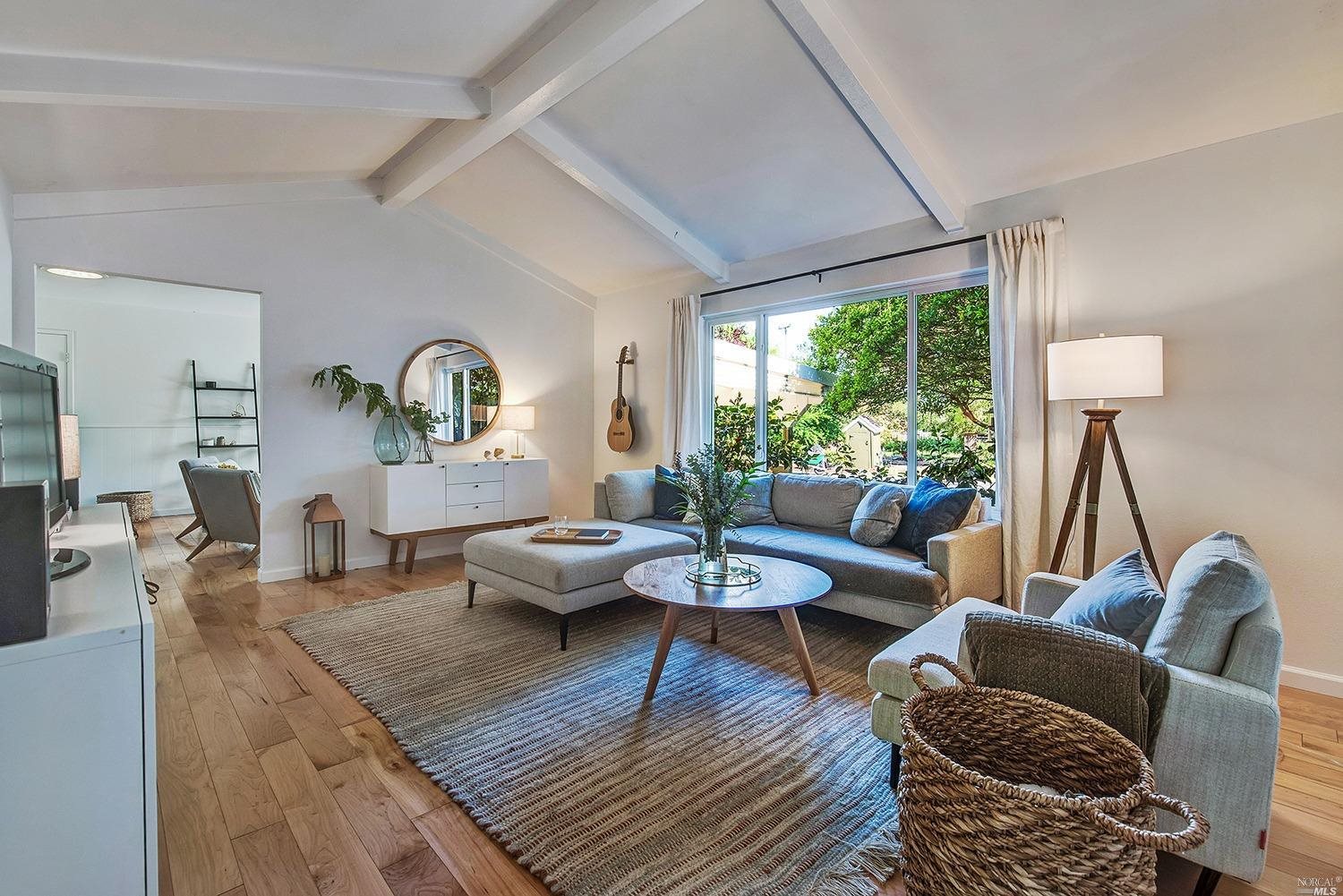 4919 Occidental Road Santa Rosa, CA 95401 - Photo 1 of 1 a living room with furniture and a large window