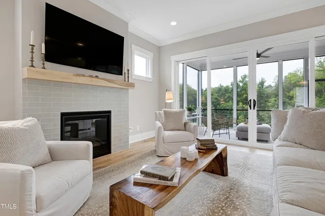 a kitchen with stainless steel appliances granite countertop a stove top oven a sink dishwasher a dining table and chairs with wooden floor