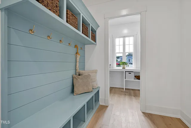 a view of washer and dryer with kitchen in the background