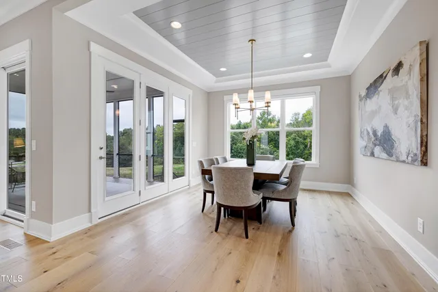 a bedroom with a bed and glass window