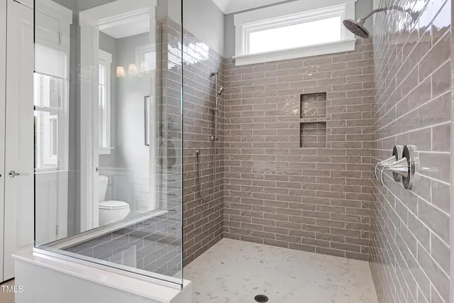 a living room with furniture a flat screen tv and a rug