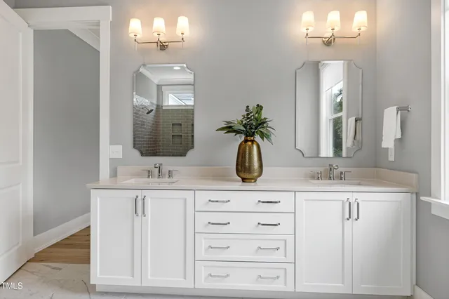 a living room with furniture a flat screen tv and a window