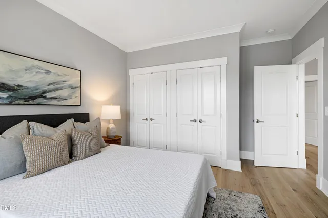 an aerial view of residential houses with outdoor space and street view