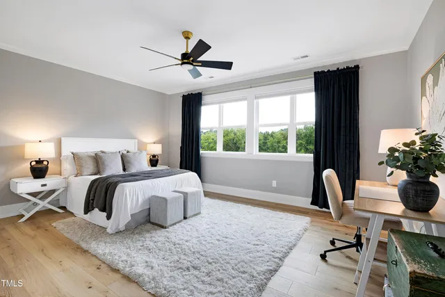 a view of a house with backyard swimming pool and sitting area