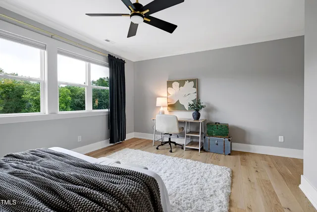 an aerial view of a house with a garden and trees