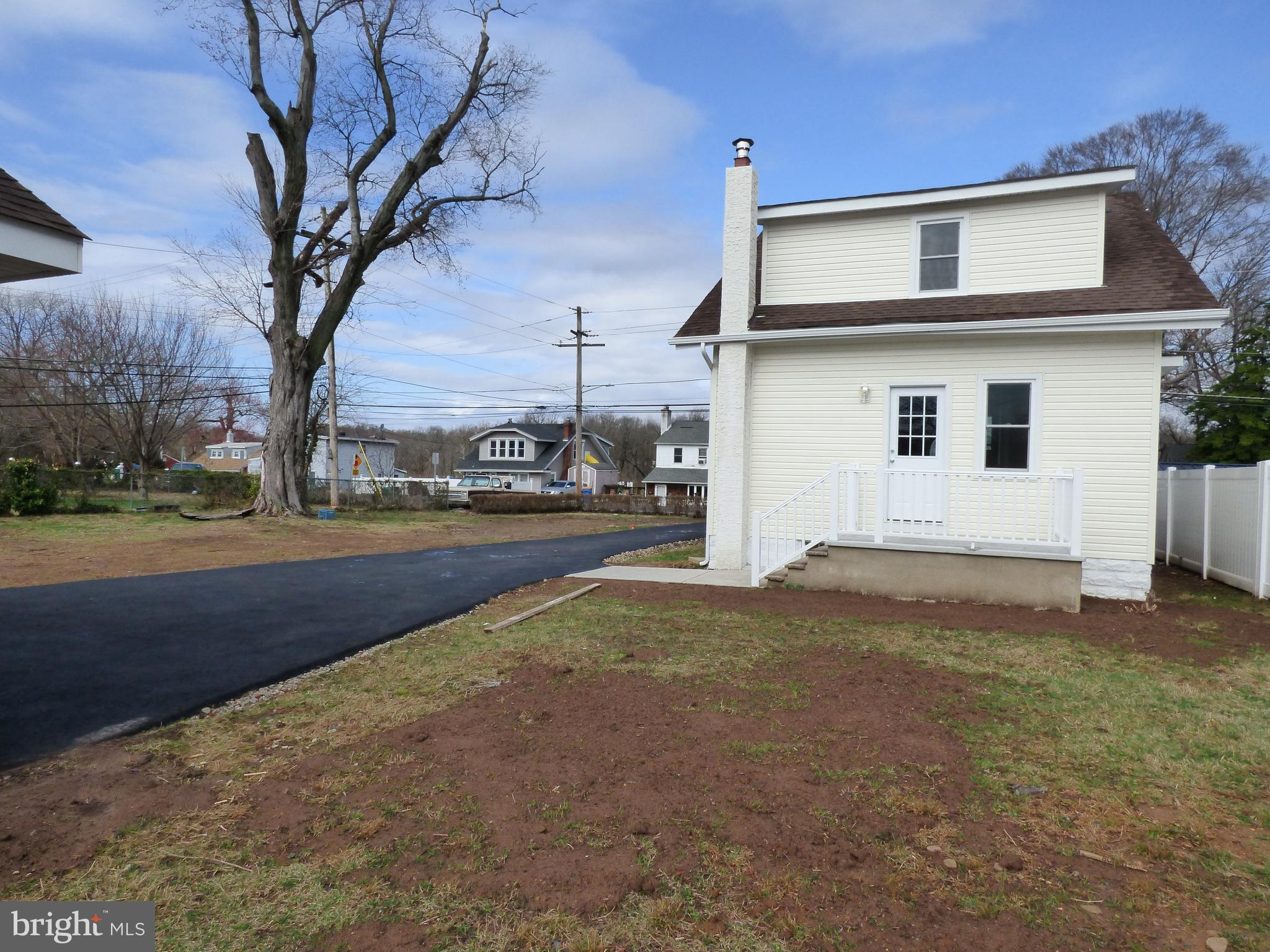 726 Newportville Road Croydon, PA 19021 - Photo 6 of 30 a front view of a house with a yard and garage