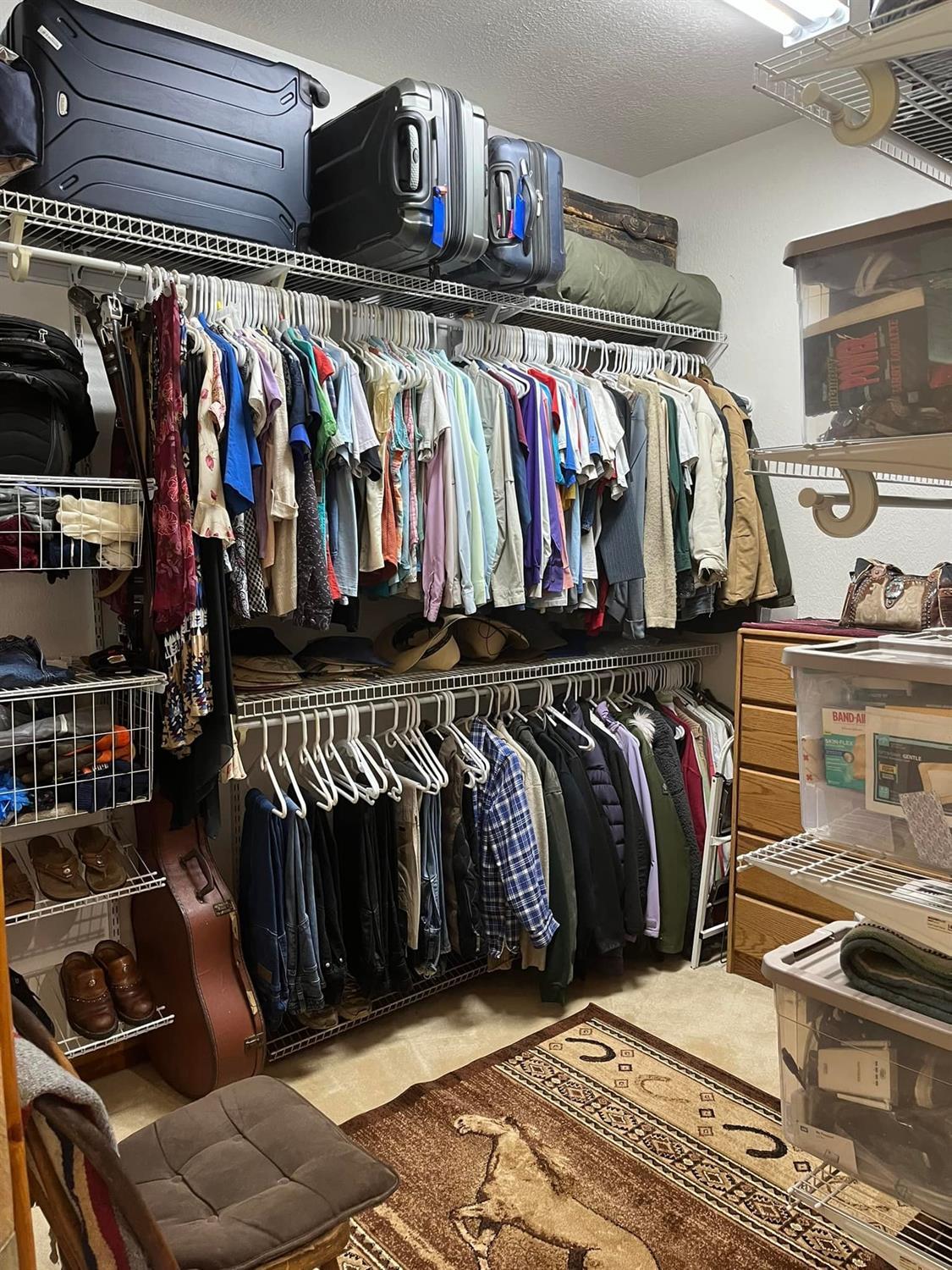 29266 Dry Creek Road Galt, CA 95632 - Photo 11 of 44 a view of walk in closet with clothes and shoes