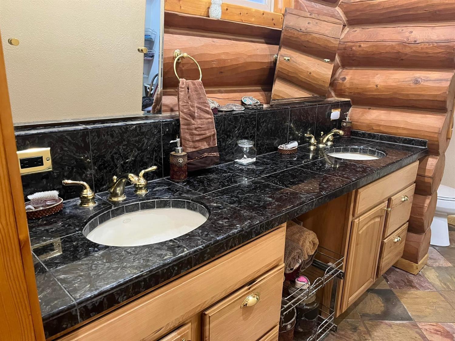 29266 Dry Creek Road Galt, CA 95632 - Photo 12 of 44 a bathroom with a granite countertop sink and a mirror