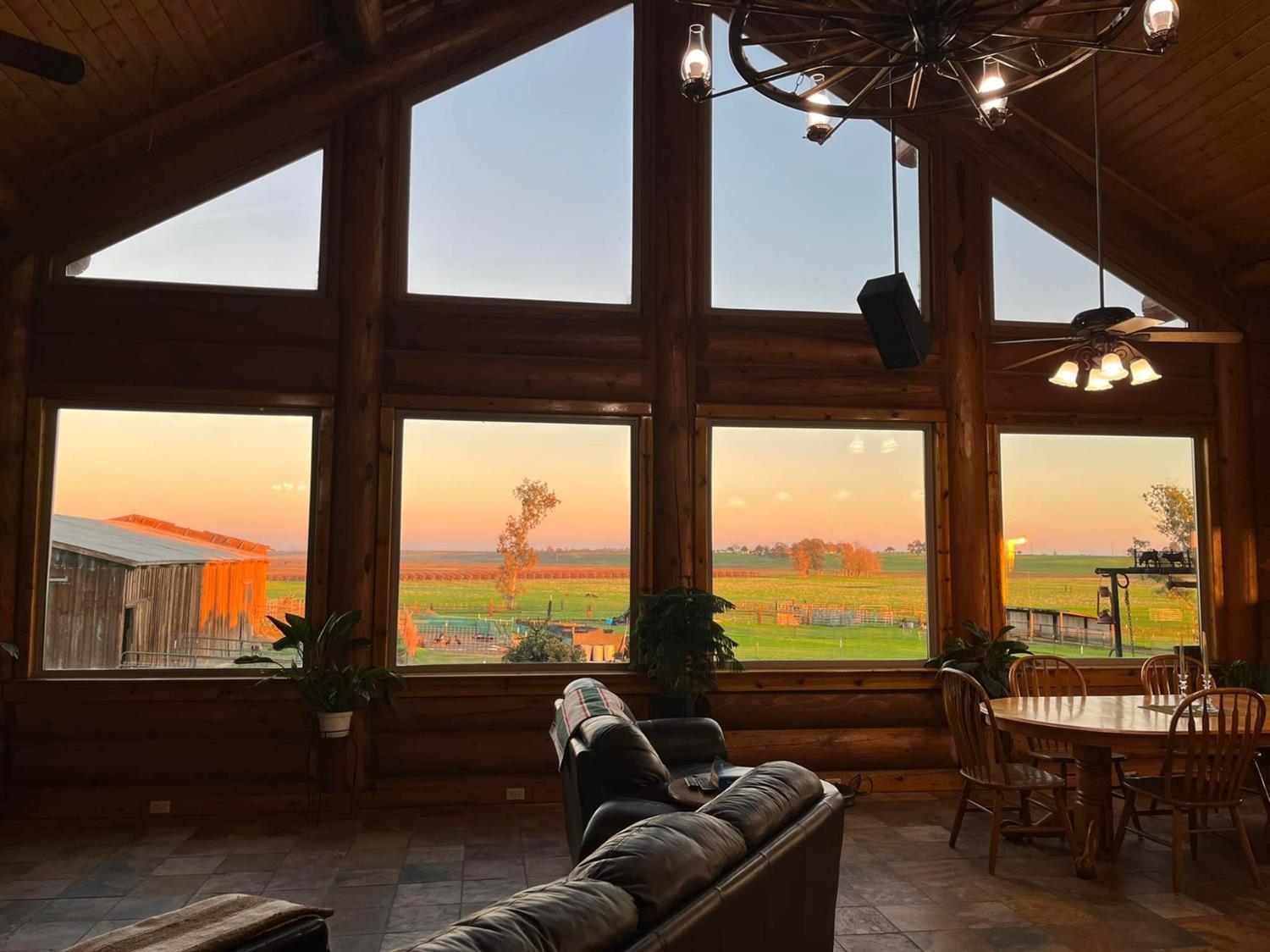 29266 Dry Creek Road Galt, CA 95632 - Photo 14 of 44 a living room with hardwood floor and large windows
