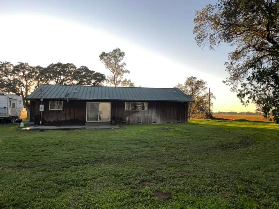 29266 Dry Creek Road Galt, CA 95632 - Photo 17 of 44 a view of a house with a yard