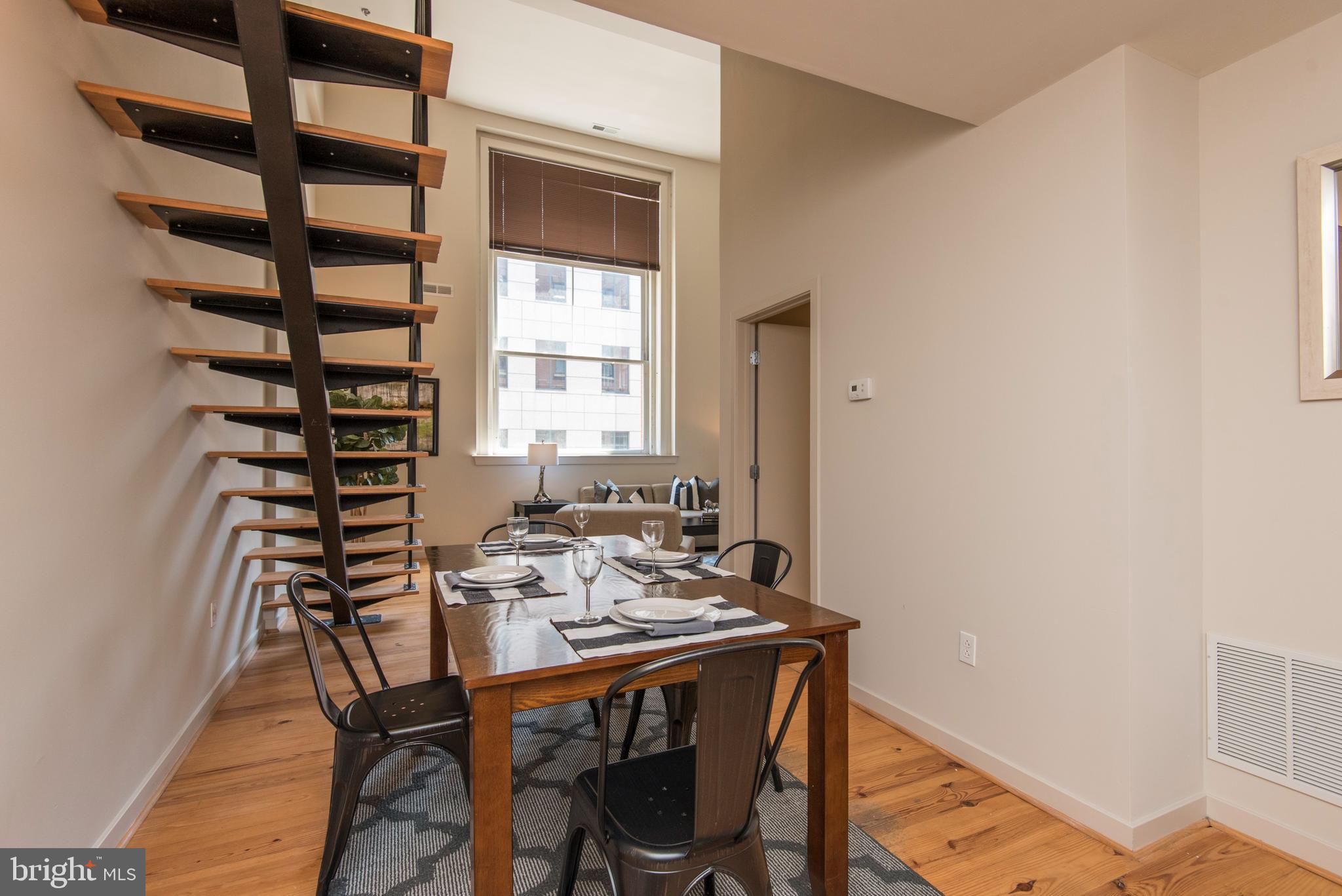 1200 Walnut Street, Unit 203 Philadelphia, PA 19107 - Photo 13 of 27 a view of a dining room that has a table and chairs in it