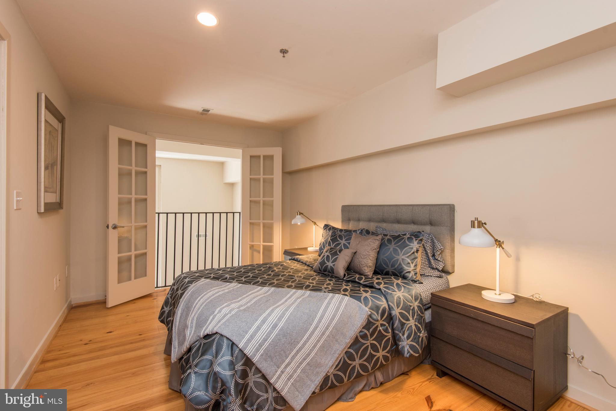 1200 Walnut Street, Unit 203 Philadelphia, PA 19107 - Photo 21 of 27 a bedroom with a bed and a window