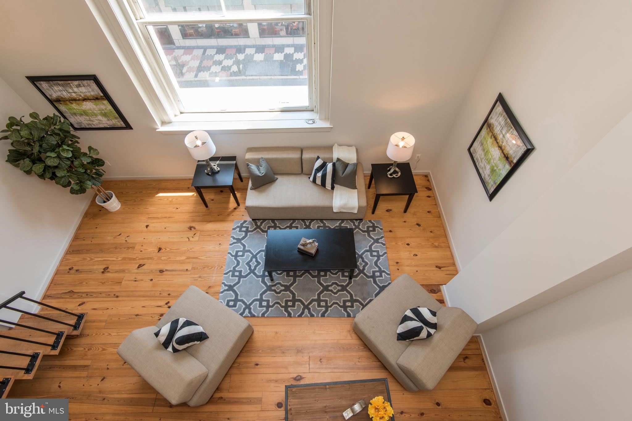 1200 Walnut Street, Unit 203 Philadelphia, PA 19107 - Photo 22 of 27 a living room with furniture and a window