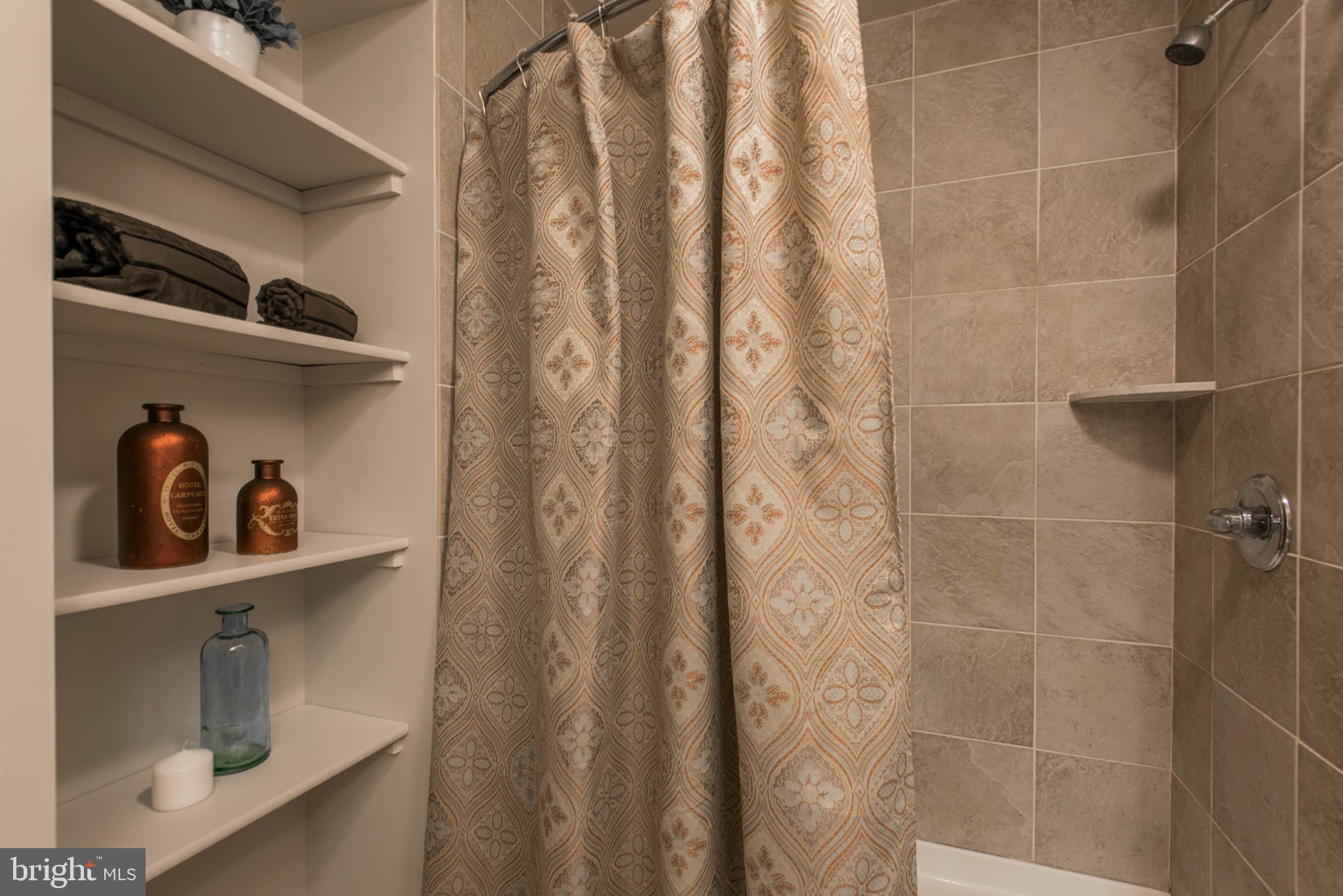 1200 Walnut Street, Unit 203 Philadelphia, PA 19107 - Photo 24 of 27 a bathroom with a window and shower