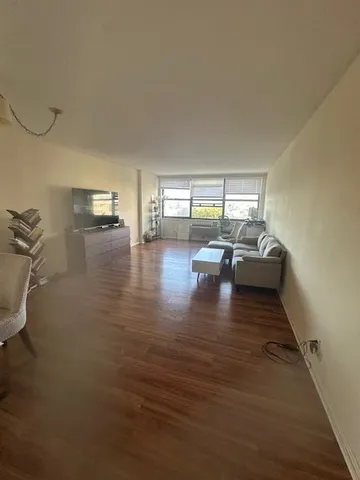 a view of kitchen and dining room with wooden floor