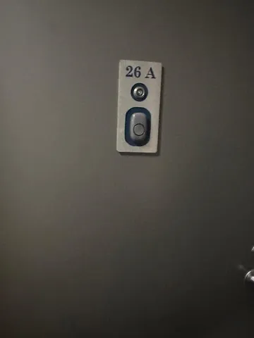 a close up of a wall with a fan