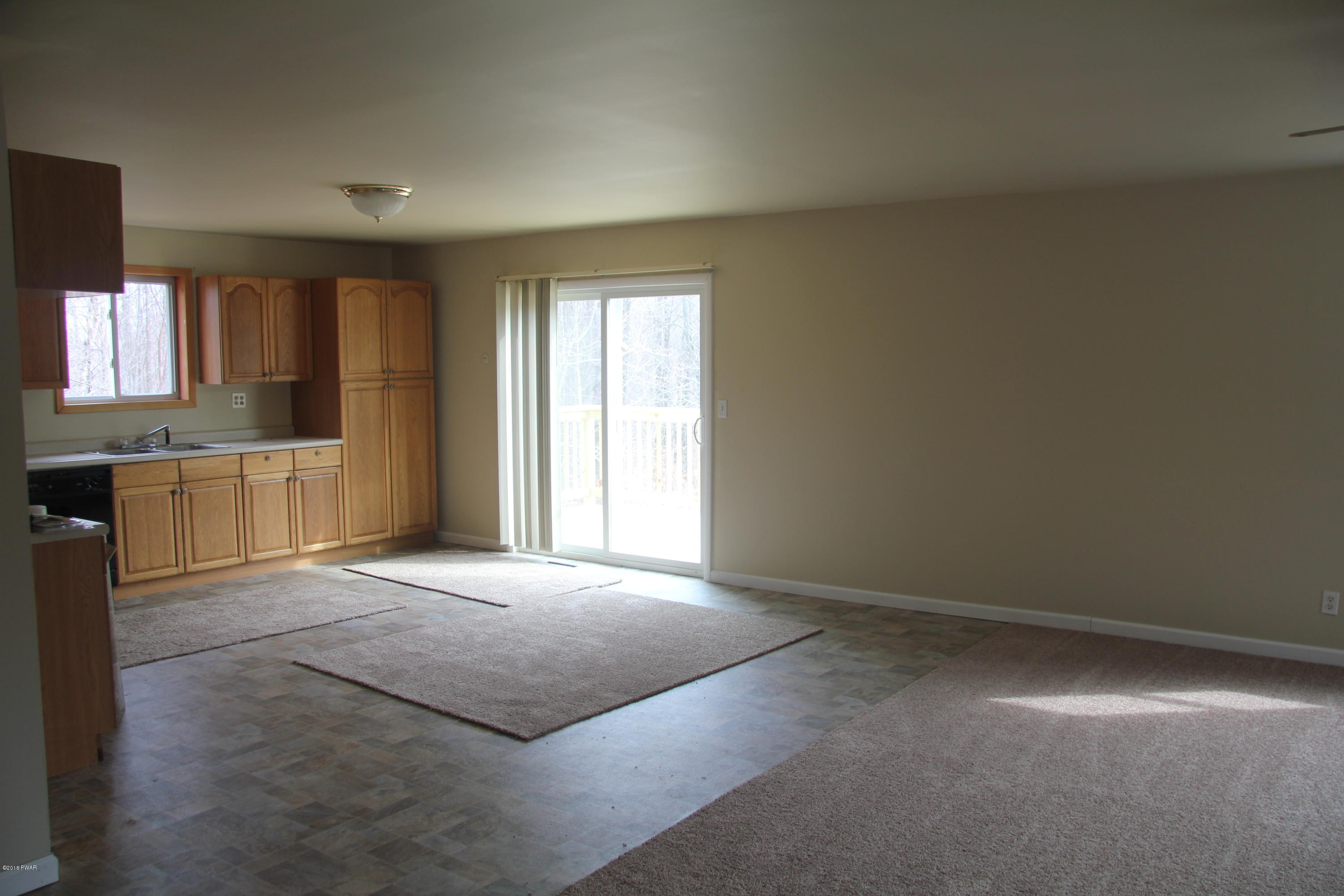 170 Swetz Road Lake Ariel, PA 18436 - Photo 2 of 16 an empty room with windows and cabinet