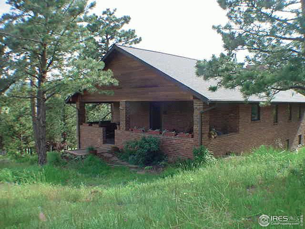 303 Mountain Meadows Road Boulder, CO 80302 - Photo 4 of 4 a view of a house with a yard plants and large tree
