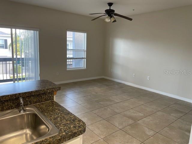 6536 South Goldenrod Road, Unit 67A Orlando, FL 32822 - Photo 5 of 14 a kitchen with a sink a counter top space and a window