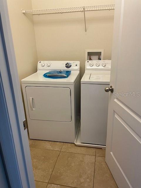 6536 South Goldenrod Road, Unit 67A Orlando, FL 32822 - Photo 6 of 14 a utility room with dryer and washer