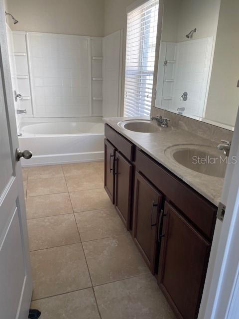 6536 South Goldenrod Road, Unit 67A Orlando, FL 32822 - Photo 9 of 14 a bathroom with a sink a vanity and a bathtub