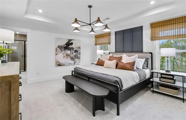 a bedroom with a bed dresser and a window