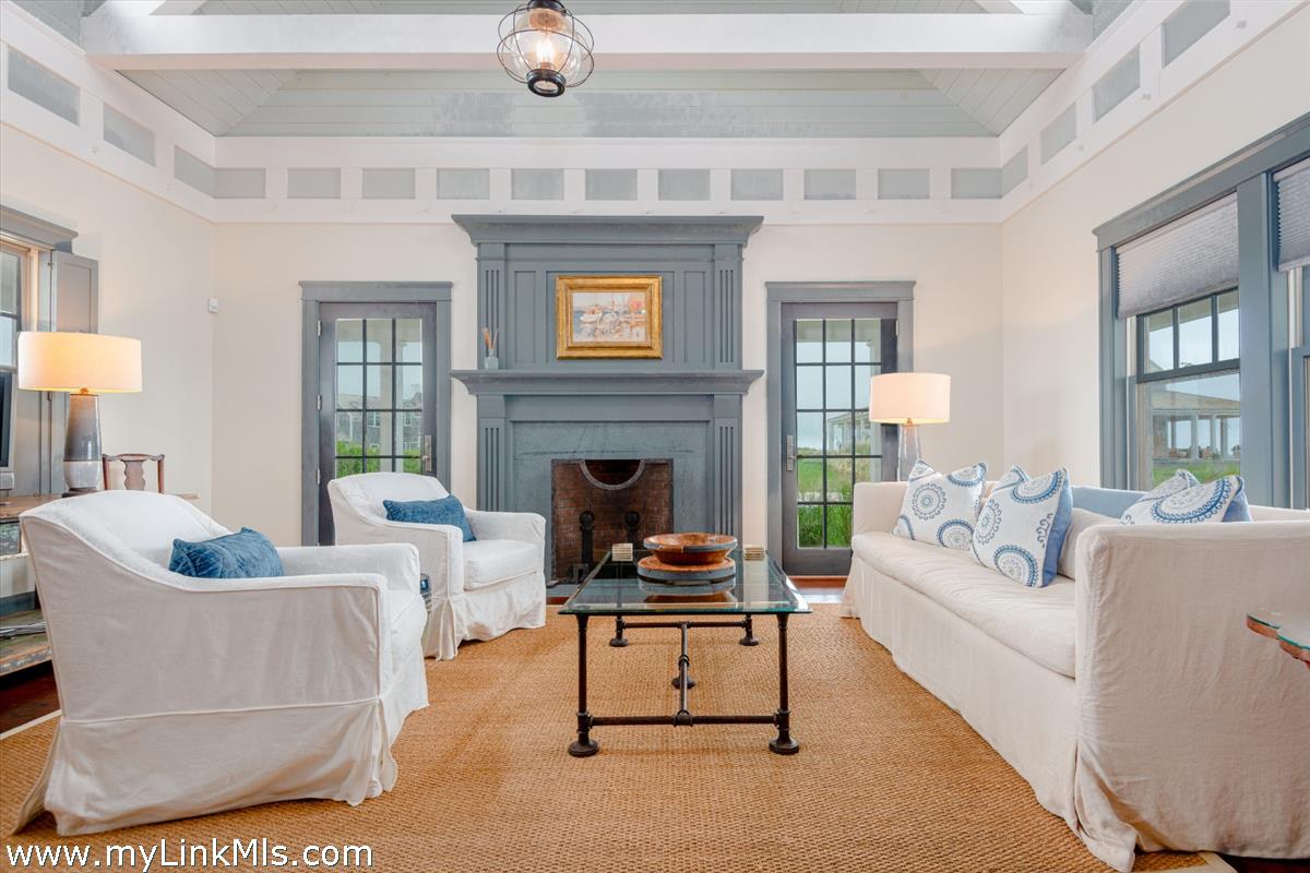 37 Sankaty Head Road Nantucket, MA 02554 - Photo 56 of 65 a living room with furniture and a fireplace