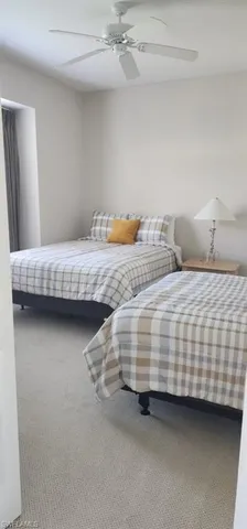 a large bathroom with a double vanity sink a mirror and a shower