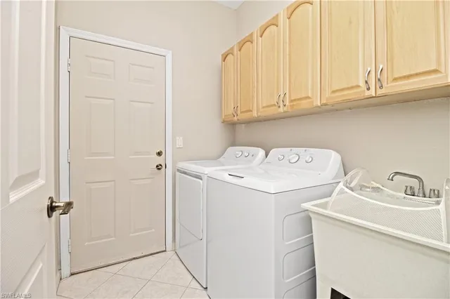 a bathroom with a sink toilet vanity and window