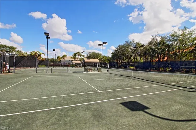 a view of a lake with houses in the back