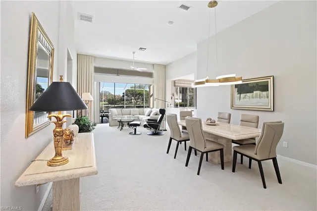 a living room with furniture fireplace and flat screen tv