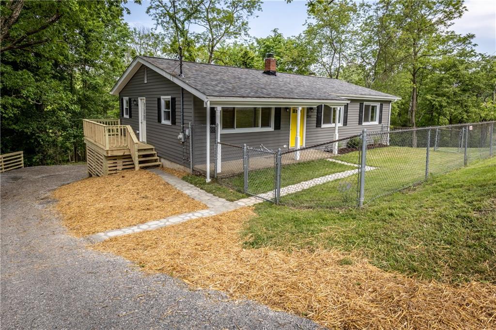 Front of Home - Porch, Fenced in Yard, Side Deck and Driveway