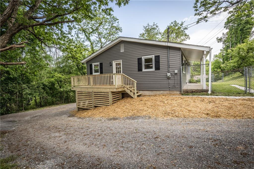 Side Deck off Kitchen and Driveway to back of home.