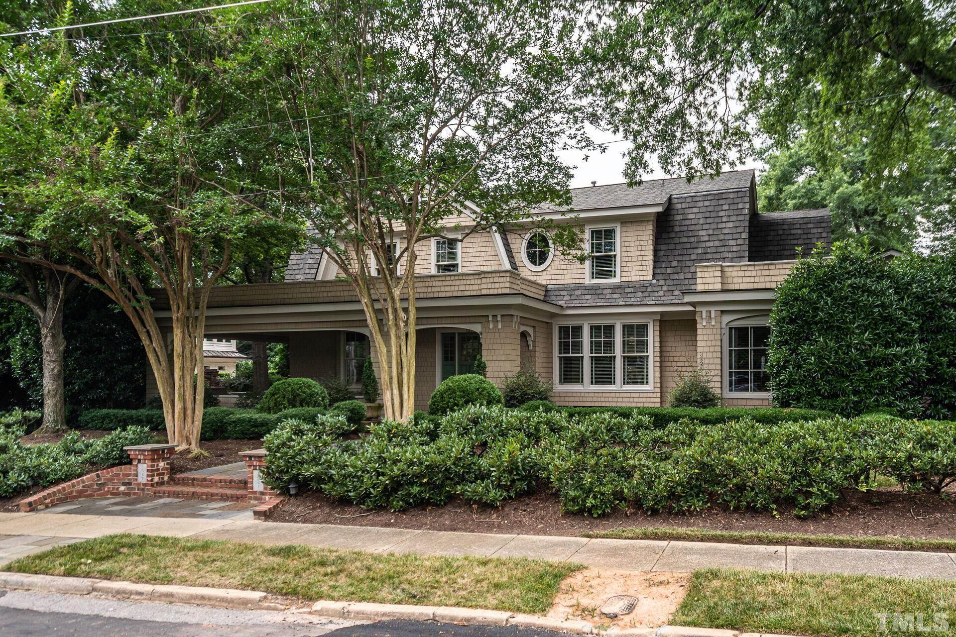 1027 Vance Street Raleigh, NC 27608 - Photo 1 of 42 a front view of a house with garden
