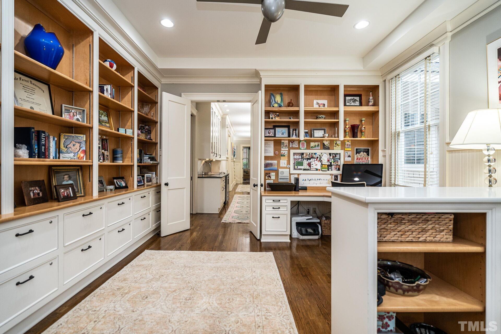 1027 Vance Street Raleigh, NC 27608 - Photo 11 of 42 a kitchen with white cabinets and window