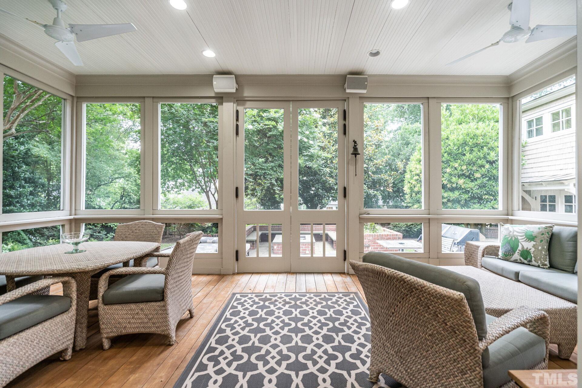 1027 Vance Street Raleigh, NC 27608 - Photo 20 of 42 a bedroom with a bed and a large window