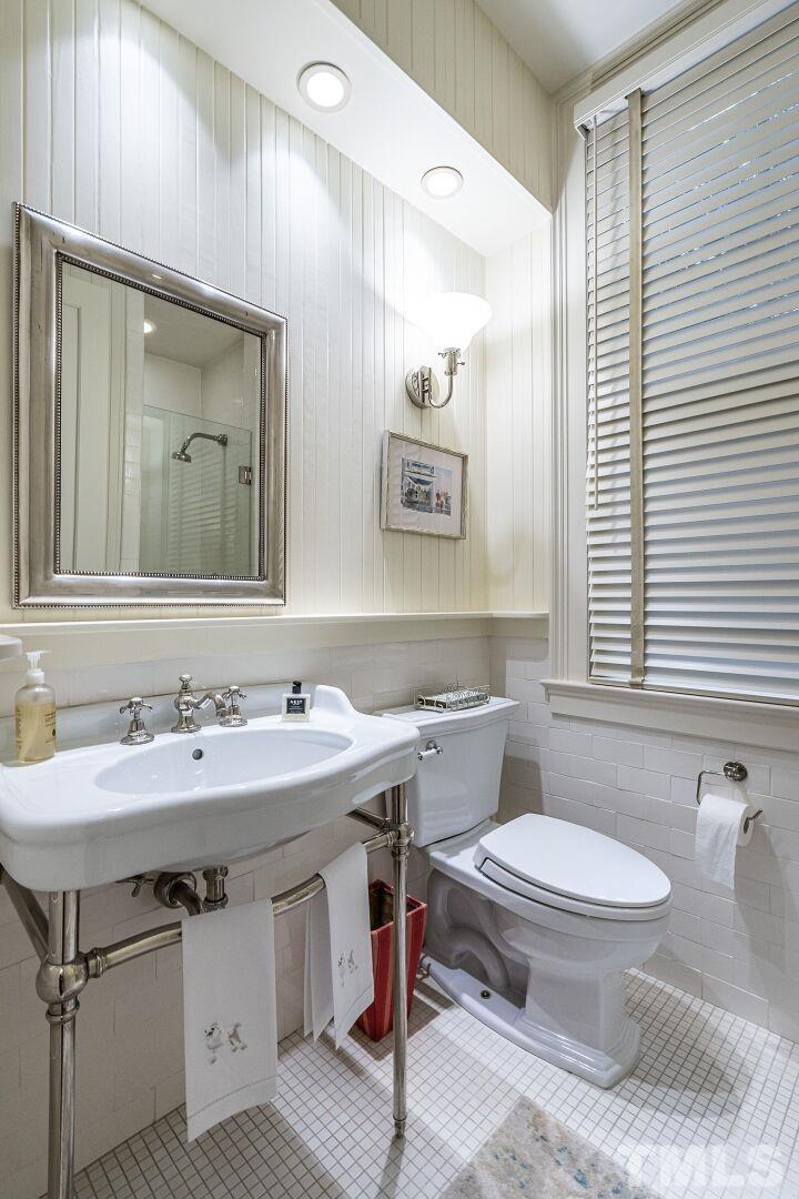1027 Vance Street Raleigh, NC 27608 - Photo 21 of 42 a bathroom with a sink and a toilet