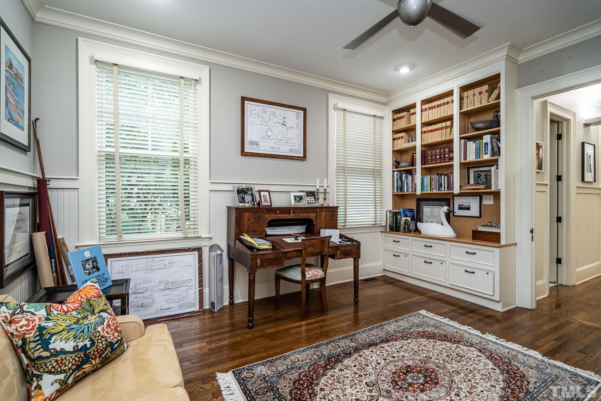 1027 Vance Street Raleigh, NC 27608 - Photo 22 of 42 a living room with furniture and a wooden floor